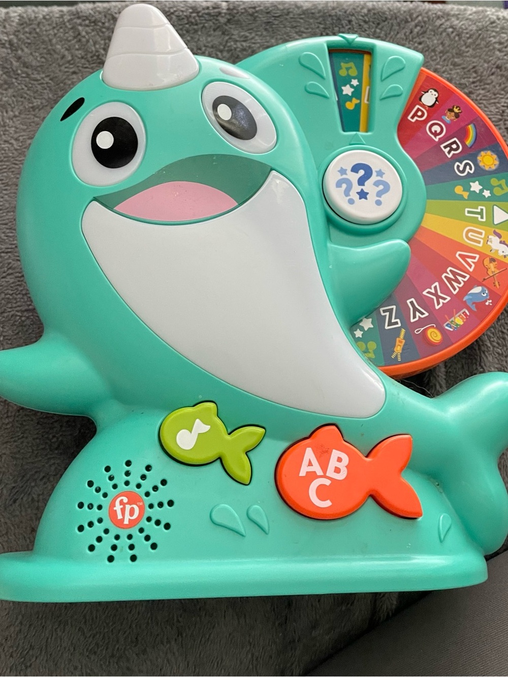 Fisher-Price Teal Narwhal Learning Toy with Colorful Alphabet Wheel